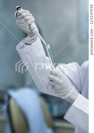 Scientist checking quality of medicine in the modern inspection laboratory in a medicine production factory 124147656