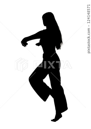 A beautiful silhouette of a woman gracefully dancing on a white background 124148571