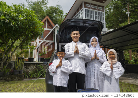 Asian Muslim family ready to mudik or travel to hometown by car. Concept of Eid Al Fitr, Idul Fitri, Lebaran, and Ramadan Mubarak celebration Asian Muslim family ready to mudik or travel to hometown by car. Concept of Eid Al Fitr, Idul Fitri, Lebaran, and Ramadan Mubarak celebration 124148605