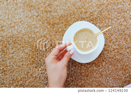 close-up. a cup of coffee on the beige Interior pile carpet. 124149230