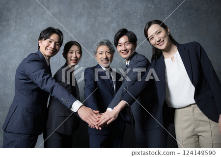 Let's all work hard together! Hey, hey, hey! The image of unity and working hard together 124149590