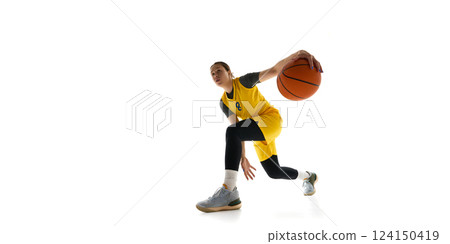 Low angle view of focused woman, basketball player with ball, dribbling, training isolated on white background 124150419