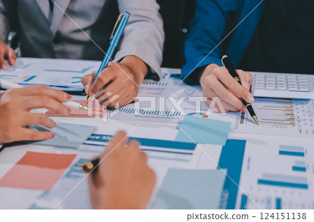 business people in meeting discussing plans together 124151138