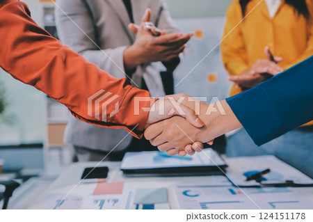 Business handshake for teamwork of business merger and acquisition,successful negotiate,hand shake,two businessman shake hand with partner to celebration partnership and business deal concept 124151178