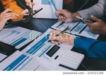 Business Team Analyzing Financial Data in Modern Office 124151196