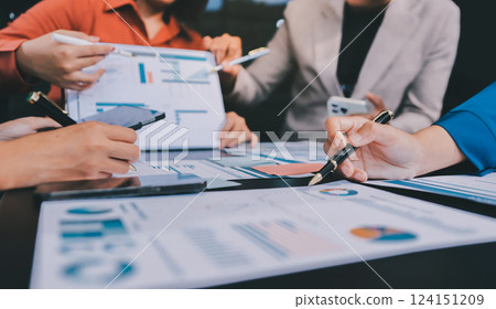 Business Team Analyzing Financial Data in Modern Office 124151209
