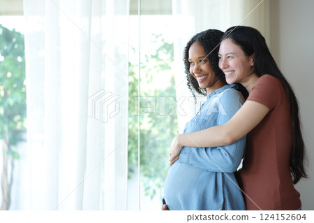 Happy interracial couple enjoying pregnancy at home 124152604