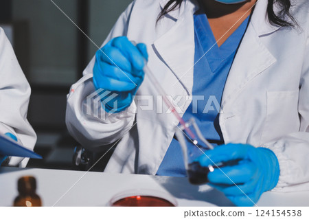 Researchers working in the clinical laboratory 124154538