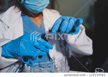 Researchers working in the clinical laboratory Researchers working in the clinical laboratory 124154565