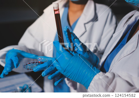 Researchers working in the clinical laboratory Researchers working in the clinical laboratory 124154582