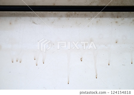 Dirty white wall in grungy loft with moisture and spider web 124154818