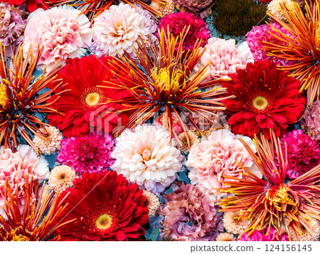 A beautiful flower water fountain decorated with January's seasonal flowers 124156145