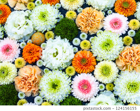 A beautiful flower water fountain decorated with January's seasonal flowers 124156155