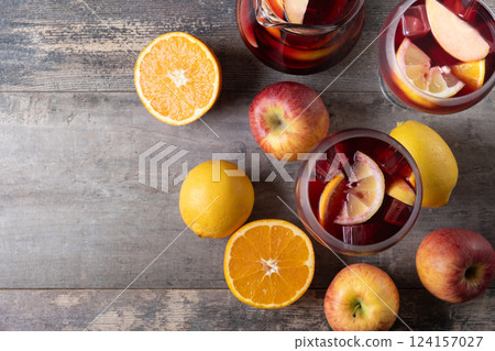 Refreshing Summer Citrus Fruit Sangria in crystal jar on wooden table 124157027