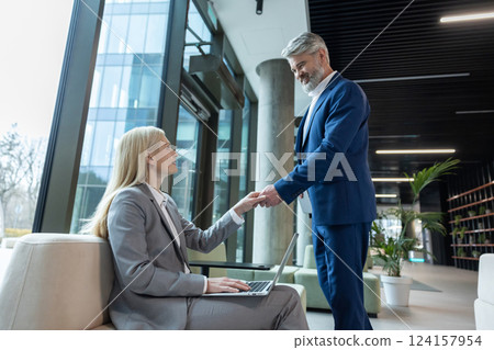 Business owner meeting a client before negotiations Business owner meeting a client before negotiations 124157954