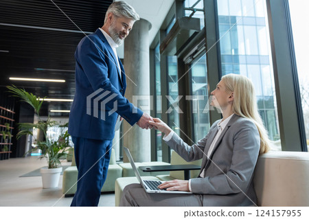 Business owner meeting a client before negotiations Business owner meeting a client before negotiations 124157955