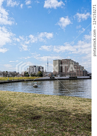 A town with a view of the spring Nakagawa River flowing through Okuto, Katsushika, Tokyo, and the Skytree 124158271