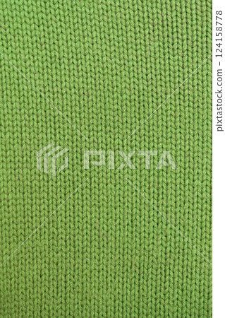 knitted texture, bright green sweater or carpet, pattern of the back and front loops. knitted texture, bright green sweater or carpet, pattern of the back and front loops. 124158778
