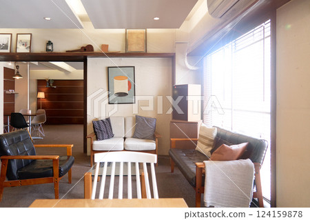 Interior image of the cafe space with bright light pouring in 124159878