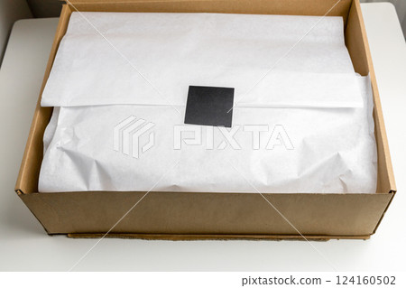 Box with an order from the fashion store Box with an order from the fashion store 124160502