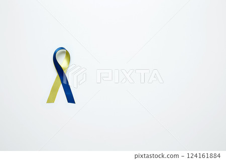 A yellow and blue awareness ribbon, symbolizing World Down Syndrome Day 124161884