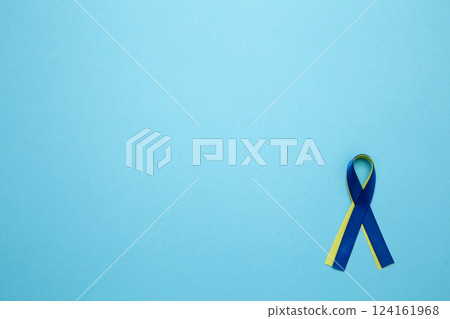 A yellow and blue awareness ribbon, symbolizing World Down Syndrome Day A yellow and blue awareness ribbon, symbolizing World Down Syndrome Day 124161968