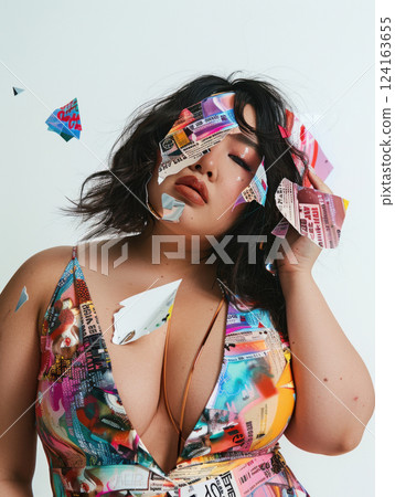 Seductive plus-size newspaper collage outfit 124163655