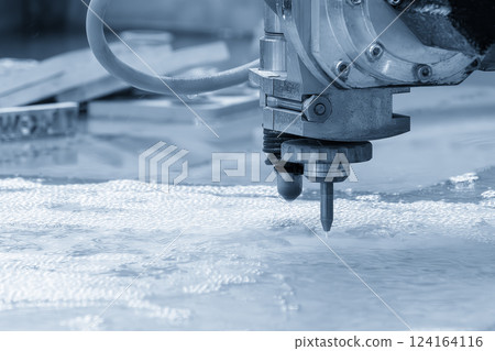 Close-up scene of multi-axis abrasive waterjet cutting machine cutting the aluminum plate. 124164116