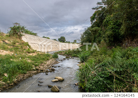The riverbank of Ylang Ylang River in Cavite, Philippines at a low water level The riverbank of Ylang Ylang River in Cavite, Philippines at a low water level 124164145