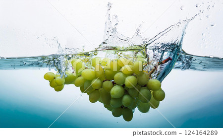 Fresh green grapes splashing into clear water, captured with dynamic motion, highlighting their natural freshness and vitality, perfect for food advertising 124164289