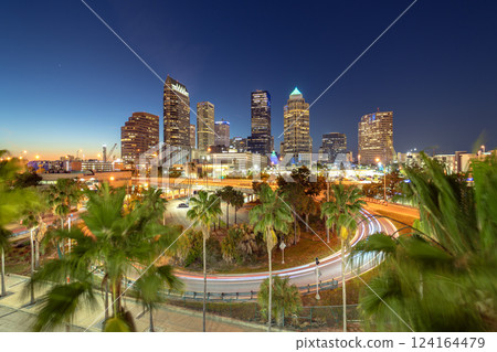 Downtown district of Tampa city in Florida, USA after sunset. Brightly illuminated highway and high buildings in modern American urban area. Downtown district of Tampa city in Florida, USA after sunset. Brightly illuminated highway and high buildings in modern American urban area. 124164479
