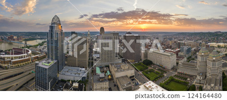 Downtown district of Cincinnati in Ohio, USA at sunset with brightly illuminated high skyscraper buildings. American travel destination 124164480