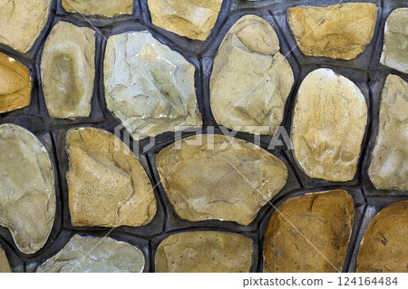 Different sizes of sand stones. Stone wall pattern background 124164484