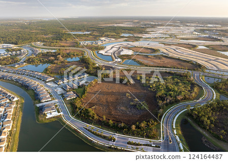 Development of residential housing in American suburbs. Beginning of construction works on prepared ground Development of residential housing in American suburbs. Beginning of construction works on prepared ground 124164487