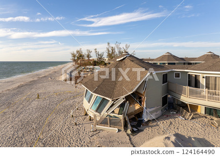 Destroyed houses on ocean shore after hurricane Milton landfall. Natural disaster consequences on Manasota Key, Florida. Storm surge severe damage 124164490