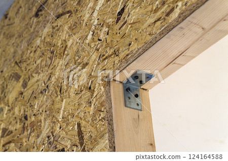 Close up detail of house construction wooden wall elements. Interior frame renovation work Close up detail of house construction wooden wall elements. Interior frame renovation work 124164588
