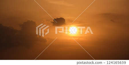 Bright colorful sunset sky with rays of setting sun and vivid dark clouds 124165639