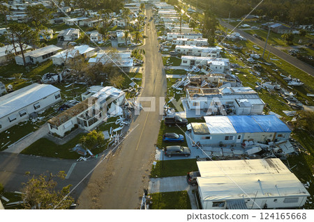 Badly damaged mobile homes after hurricane Ian in Florida residential area. Consequences of natural disaster 124165668