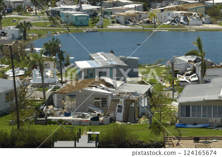 Badly damaged mobile homes after hurricane Ian in Florida residential area. Consequences of natural disaster Badly damaged mobile homes after hurricane Ian in Florida residential area. Consequences of natural disaster 124165674