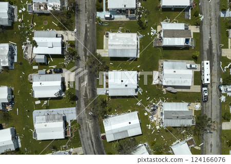 Aerial view of natural disaster consequences. Severely damaged by hurricane Ian mobile homes in Florida residential area Aerial view of natural disaster consequences. Severely damaged by hurricane Ian mobile homes in Florida residential area 124166076