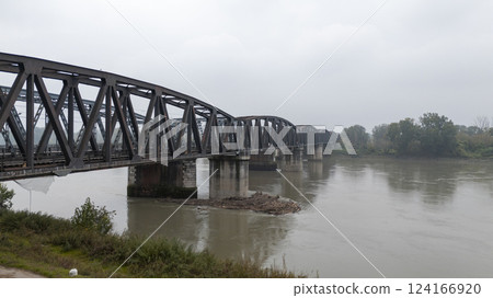 Old railway bridge crossing the po river in cremona italy Old railway bridge crossing the po river in cremona italy 124166920