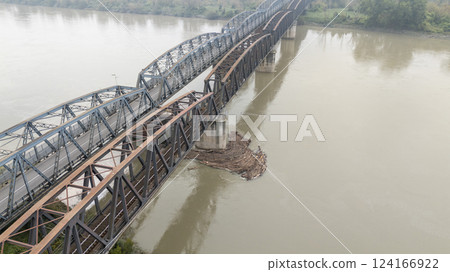 Debris accumulating near bridge pylons on the po river in cremona 124166922