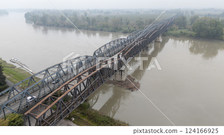 Aerial view of cars crossing bridge over po river in foggy cremona Aerial view of cars crossing bridge over po river in foggy cremona 124166925