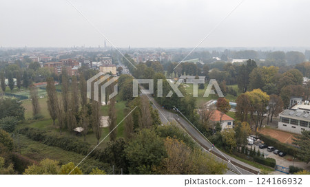 Aerial view of cremona showing the cityscape and parkland along the po river in lombardy, italy 124166932