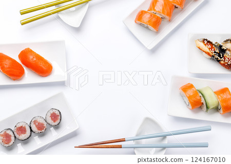 Assorted sushi and maki rolls beautifully arranged on plates Assorted sushi and maki rolls beautifully arranged on plates 124167010