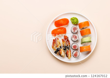 Assorted sushi and maki rolls beautifully arranged on plate 124167012