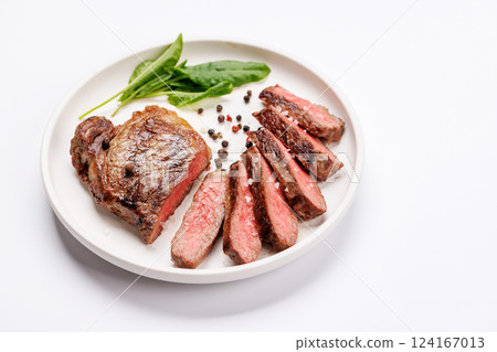 A perfectly cooked sliced striploin steak with a juicy, tender texture 124167013