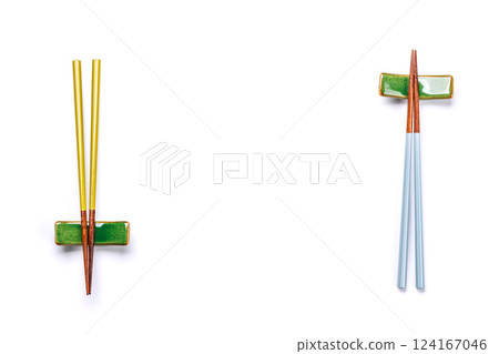 A sushi chopsticks and a small bowls, elegantly arranged on a clean white background 124167046
