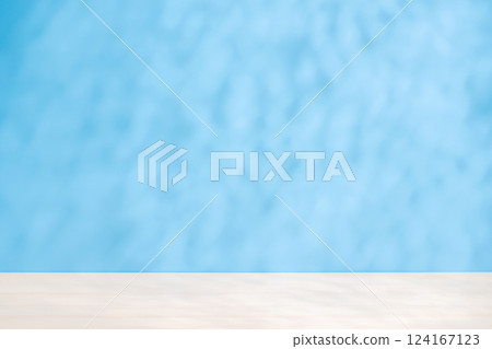 Template with empty table and wall with natural shadow and sunny glare 124167123