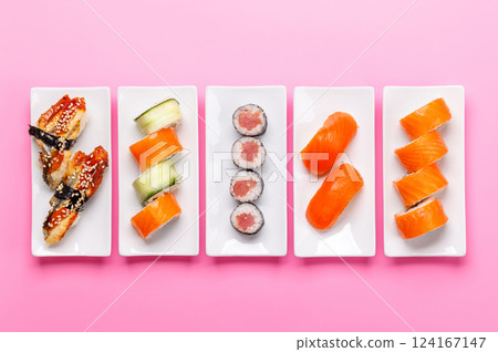 Assorted sushi and maki rolls beautifully arranged on plates Assorted sushi and maki rolls beautifully arranged on plates 124167147